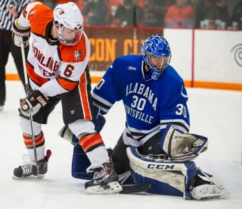 Matt Larose, who came into the game in relief, makes a stop on Bowling Green's Mitchell McLain. (Photo by Todd Pavlack/BGSUHockey.com)